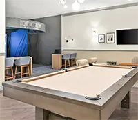 Students playing gaming table at Identity Dinkytown